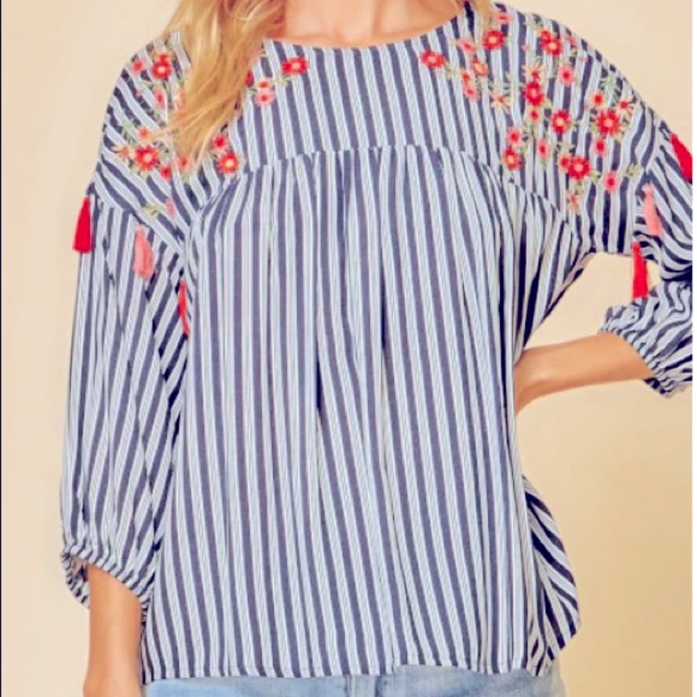 Floral embroidery and tassels
